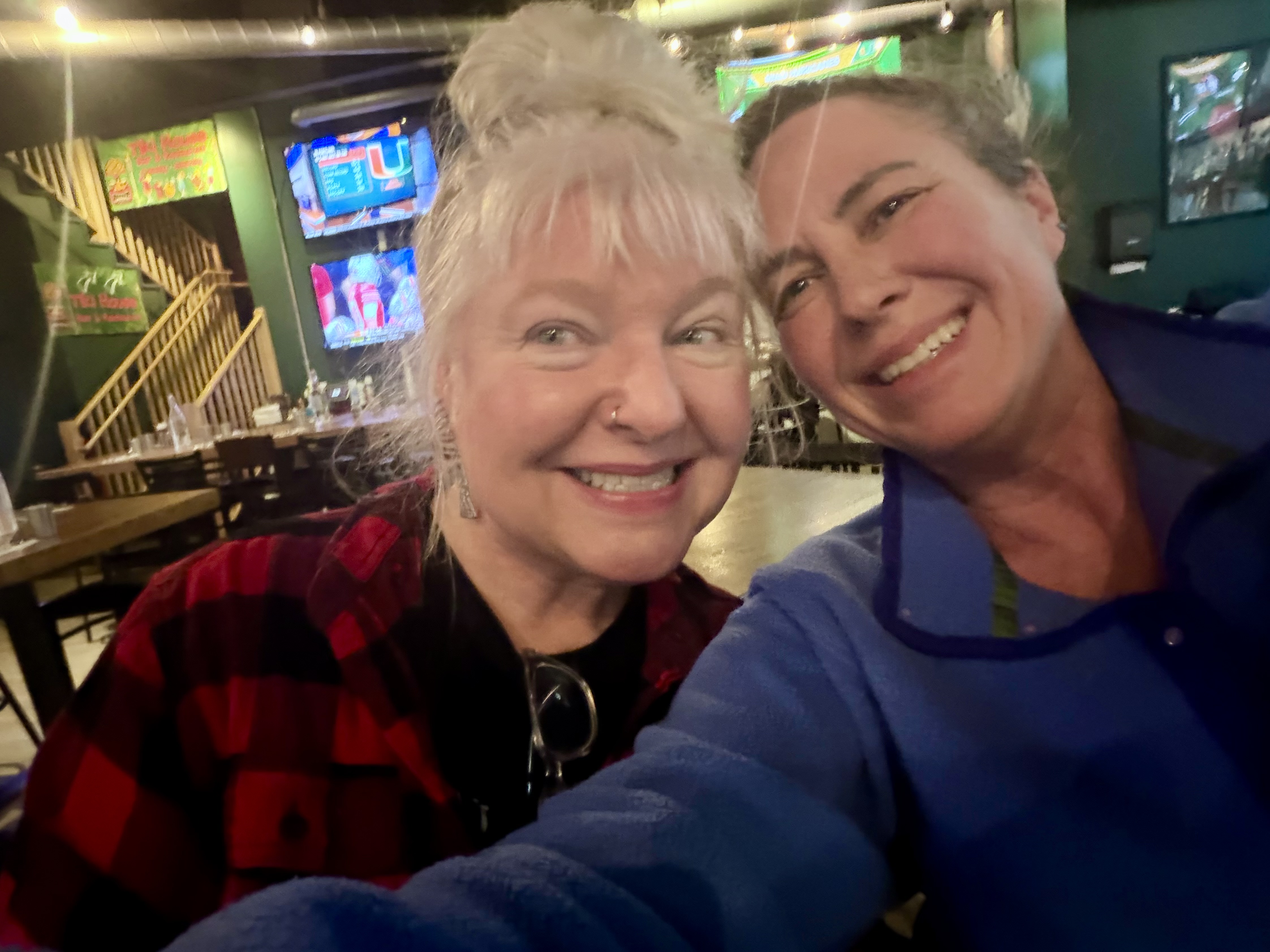 Friends enjoying food at Eagle River Alehouse