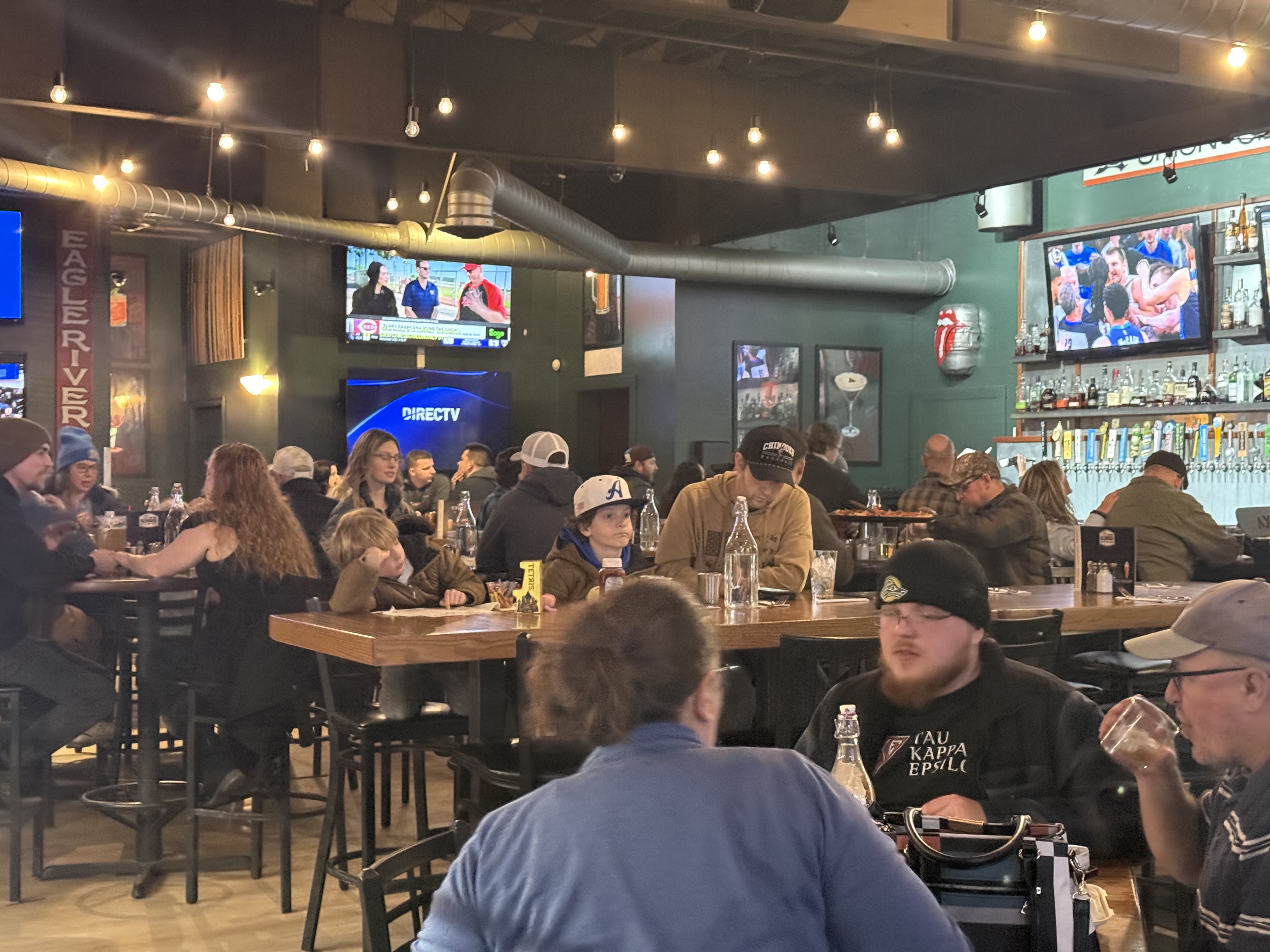 Guests smiling at Eagle River Alehouse
